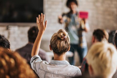 Woman raising hand