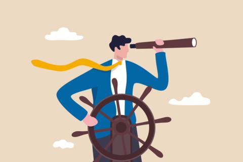 Businessman holding wheel