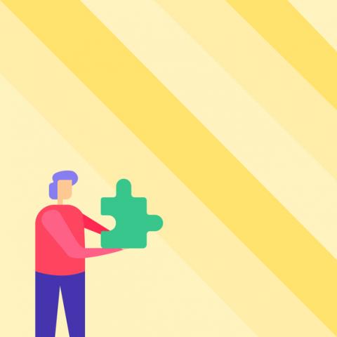 Person holding puzzle piece
